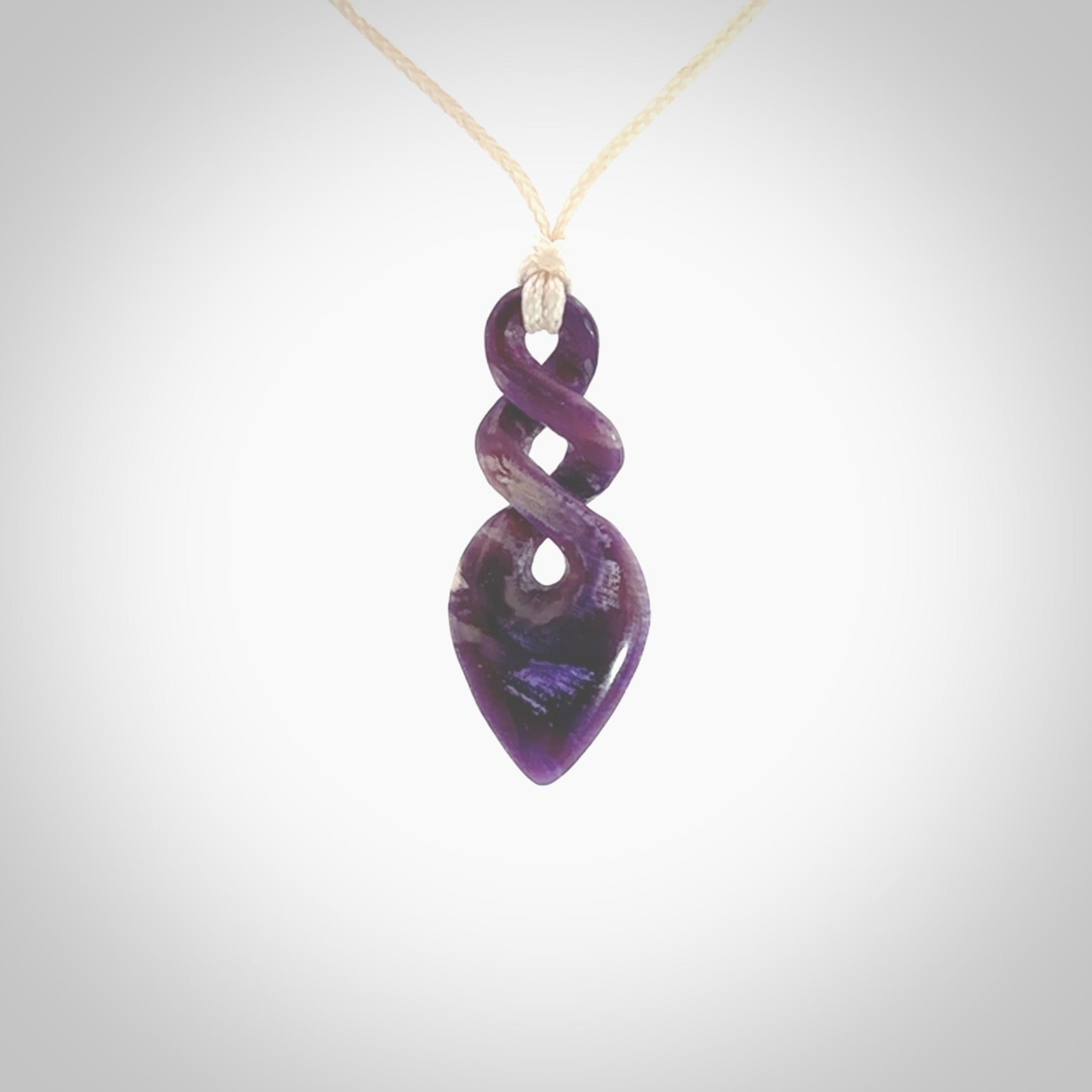 Hand carved woolly mammoth tusk double twist pendant. Made by NZ Pacific.