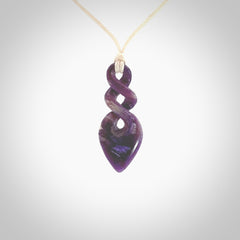 Hand carved woolly mammoth tusk double twist pendant. Made by NZ Pacific.