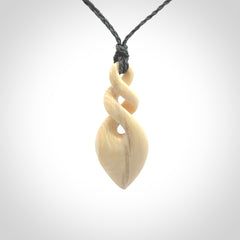 Elegant and striking twist pendants carved from mammoth tusk that's over 30,000 years old - a beautiful and ancient material.