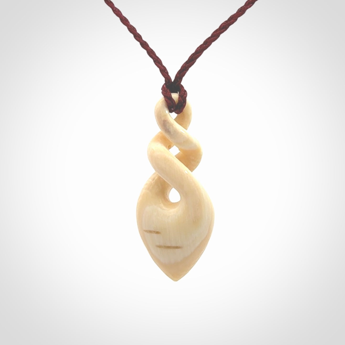 Elegant and striking twist pendants carved from mammoth tusk that's over 30,000 years old - a beautiful and ancient material.