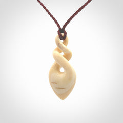 Elegant and striking twist pendants carved from mammoth tusk that's over 30,000 years old - a beautiful and ancient material.
