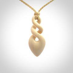 Hand carved woolly mammoth tusk twist pendant. Made by NZ Pacific.