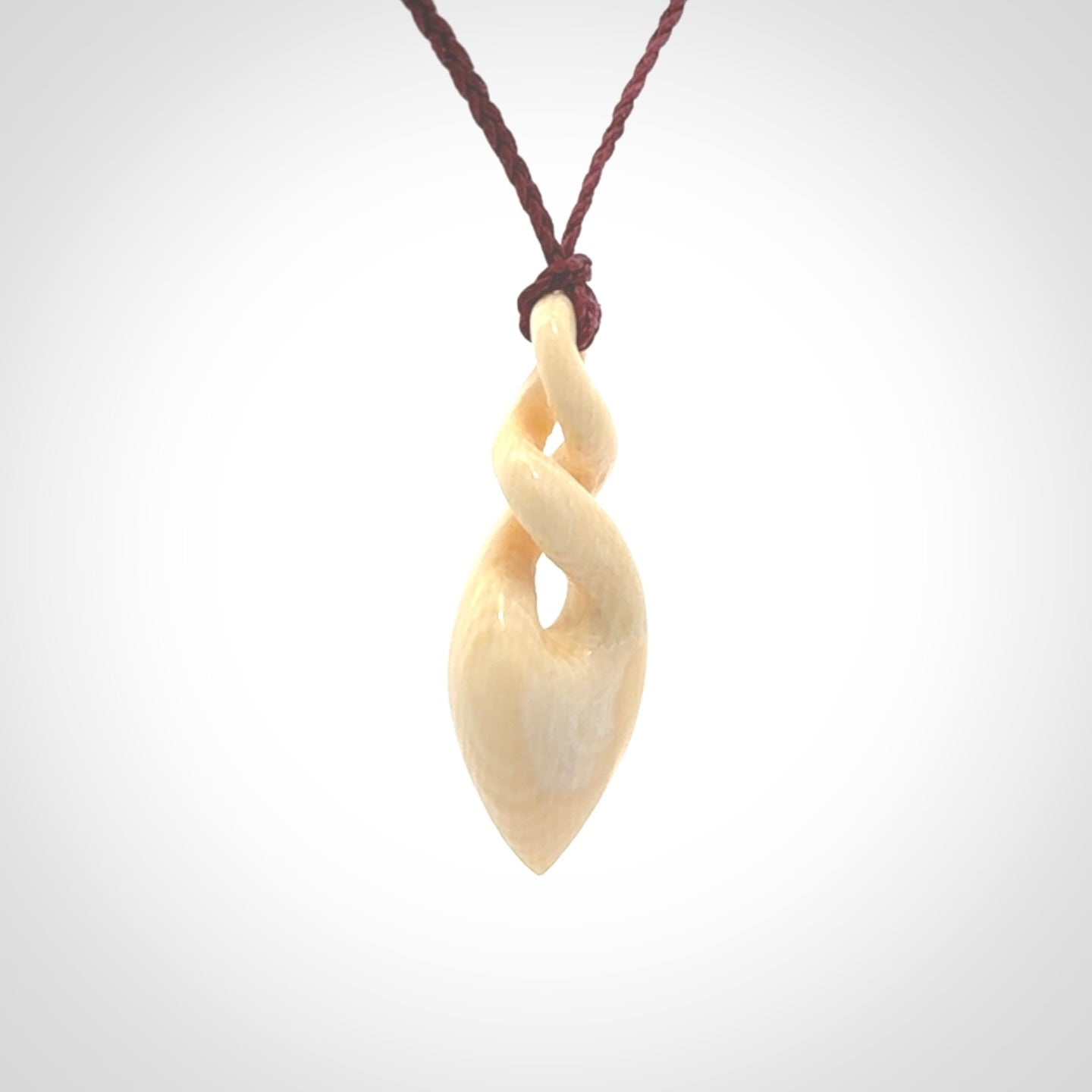 Elegant and striking twist pendants carved from mammoth tusk that's over 30,000 years old - a beautiful and ancient material.