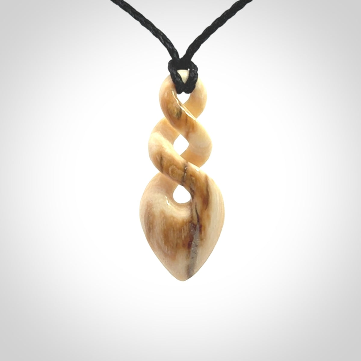 Hand carved woolly mammoth tusk twist pendant. Made by NZ Pacific.