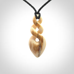 Hand carved woolly mammoth tusk twist pendant. Made by NZ Pacific.