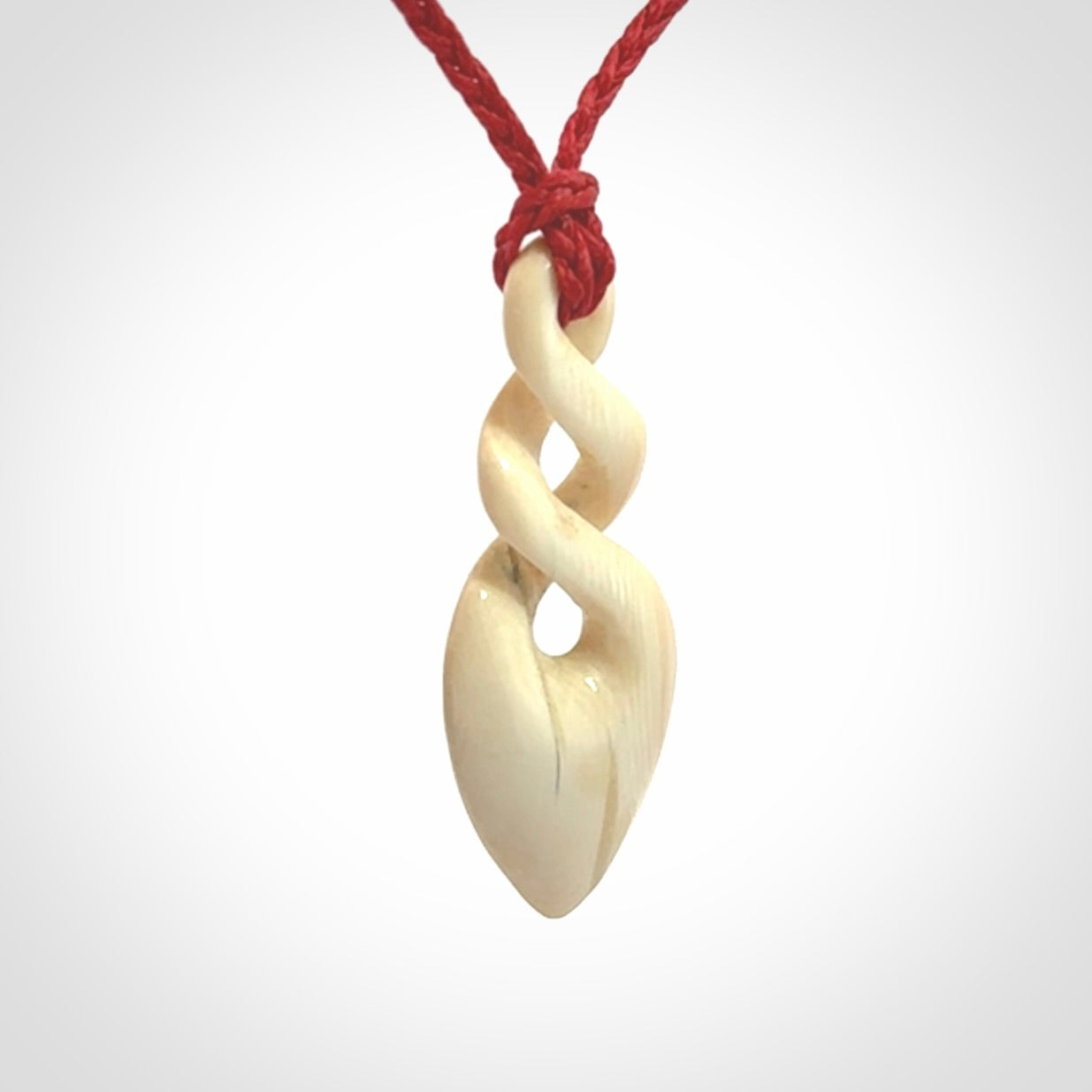 Hand carved woolly mammoth tusk twist pendant. Made by NZ Pacific.