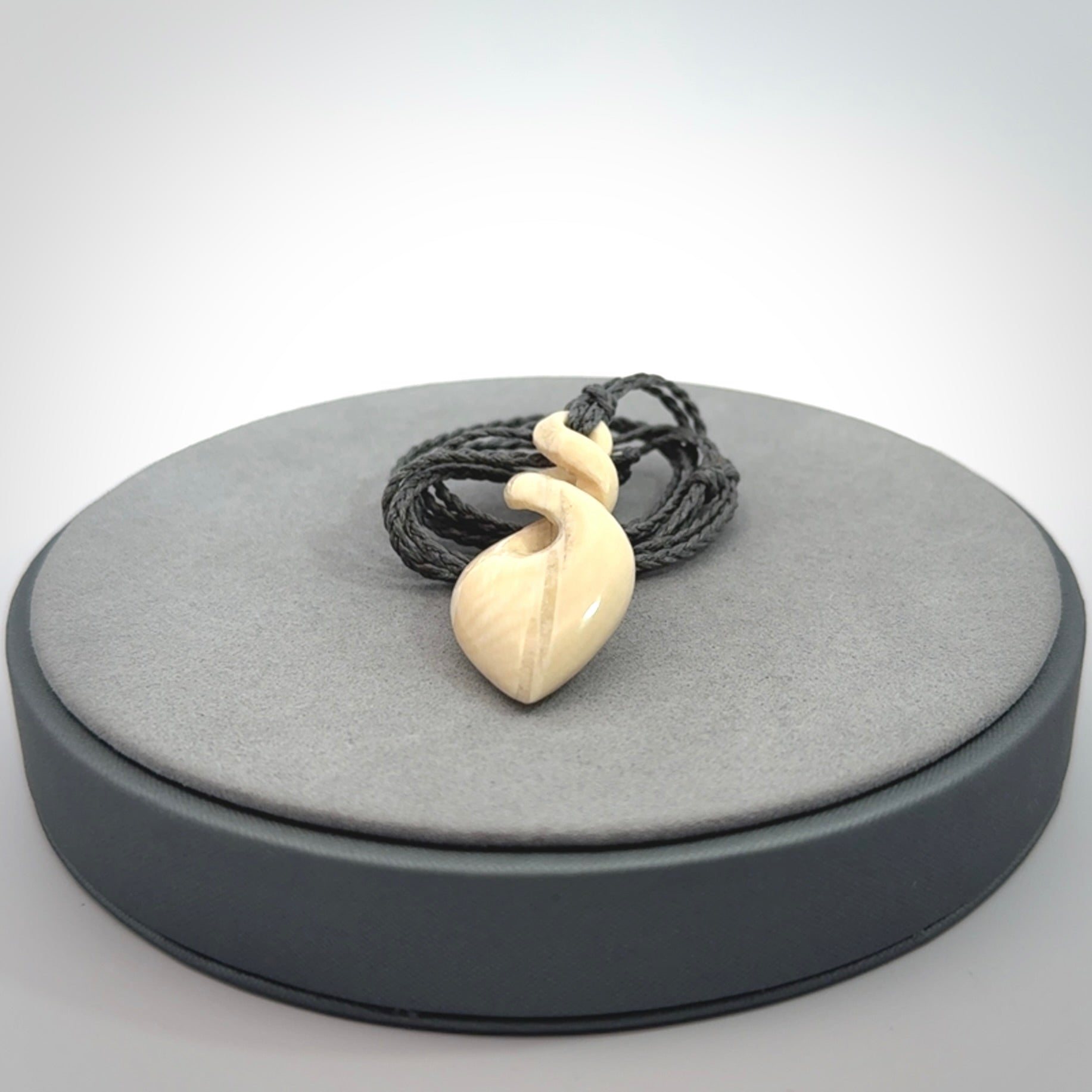 Elegant and striking twist pendants carved from mammoth tusk that's over 30,000 years old - a beautiful and ancient material.