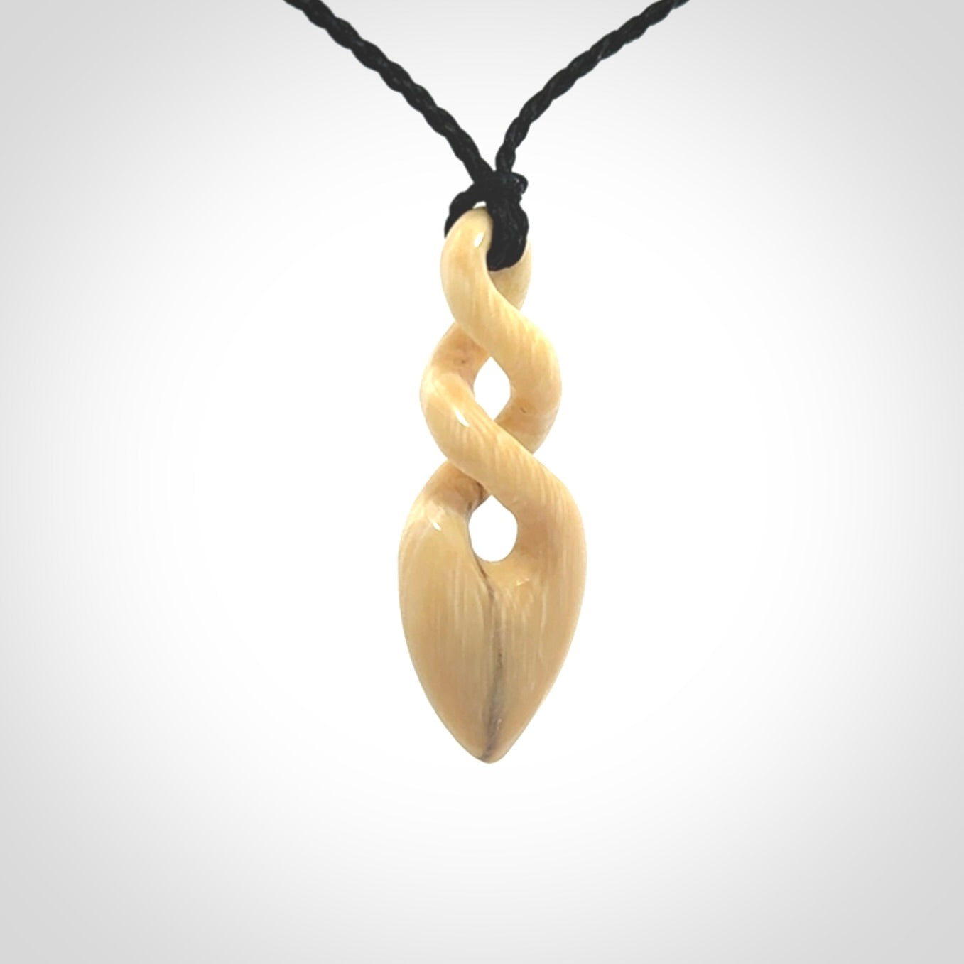 Hand carved woolly mammoth tusk twist pendant. Made by NZ Pacific.