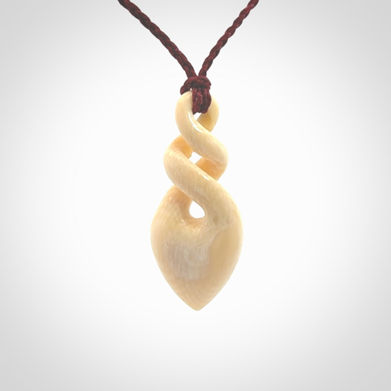 Elegant and striking twist pendants carved from mammoth tusk that's over 30,000 years old - a beautiful and ancient material.