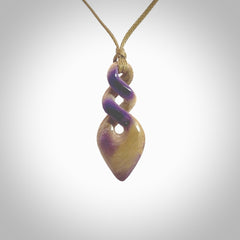 Hand carved woolly mammoth tusk double twist pendant. Made by NZ Pacific.