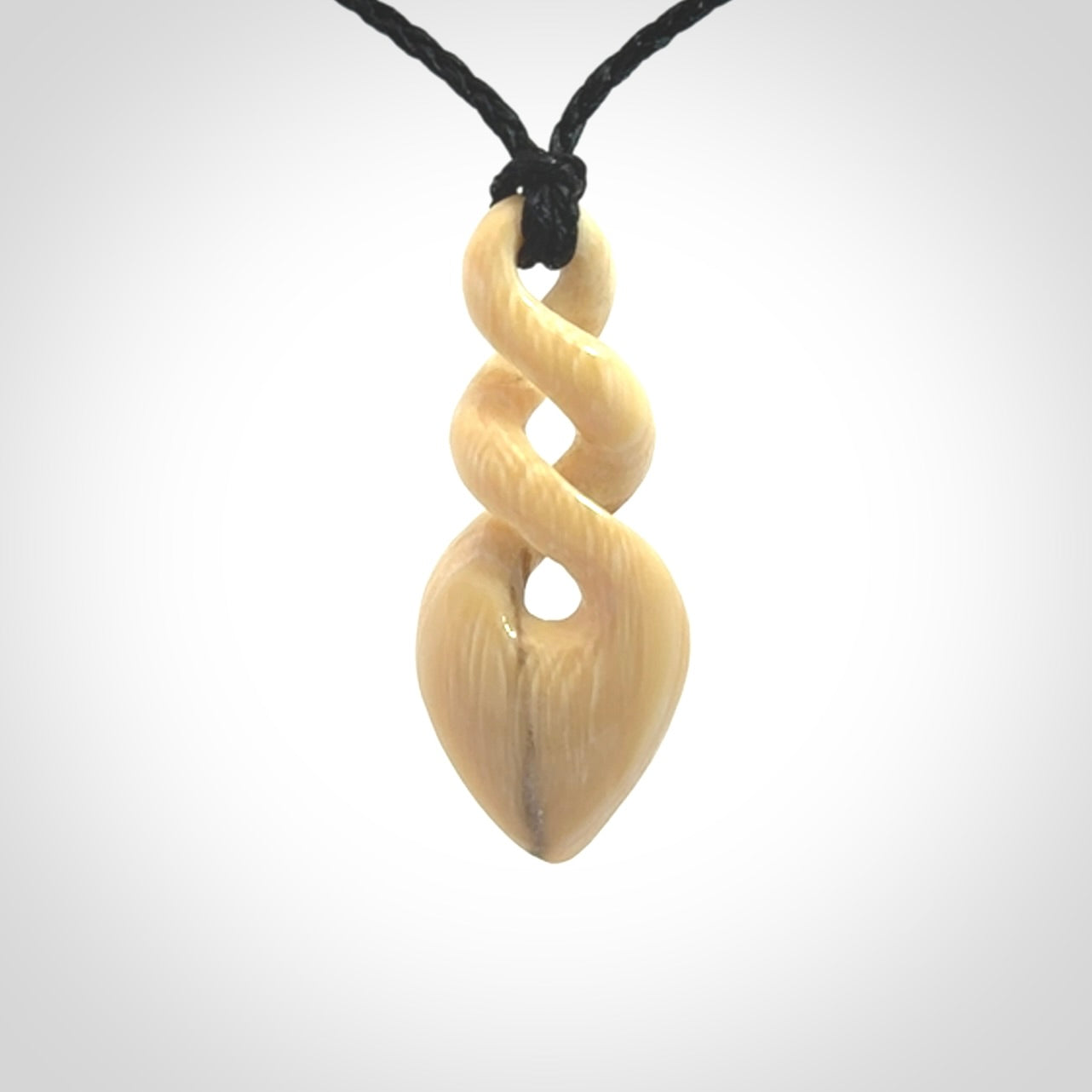 Hand carved woolly mammoth tusk twist pendant. Made by NZ Pacific.