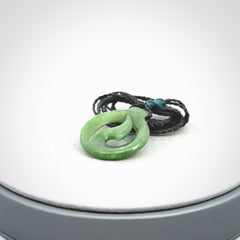 Jade matau or hook pendant. Carved from New Zealand pounamu in New Zealand. Hand carved jade jewellery for sale online.