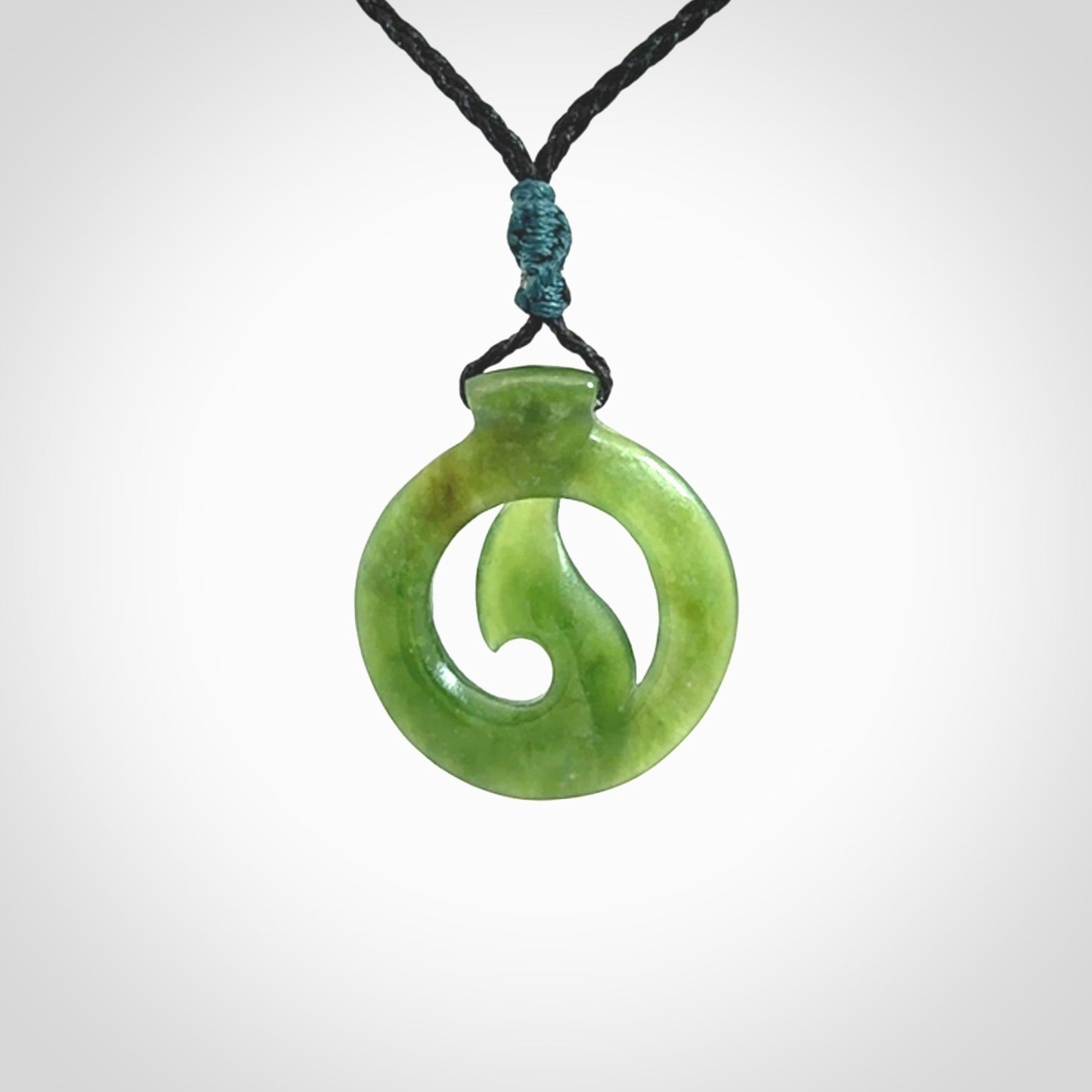 Jade matau or hook pendant. Carved from New Zealand pounamu in New Zealand. Hand carved jade jewellery for sale online.
