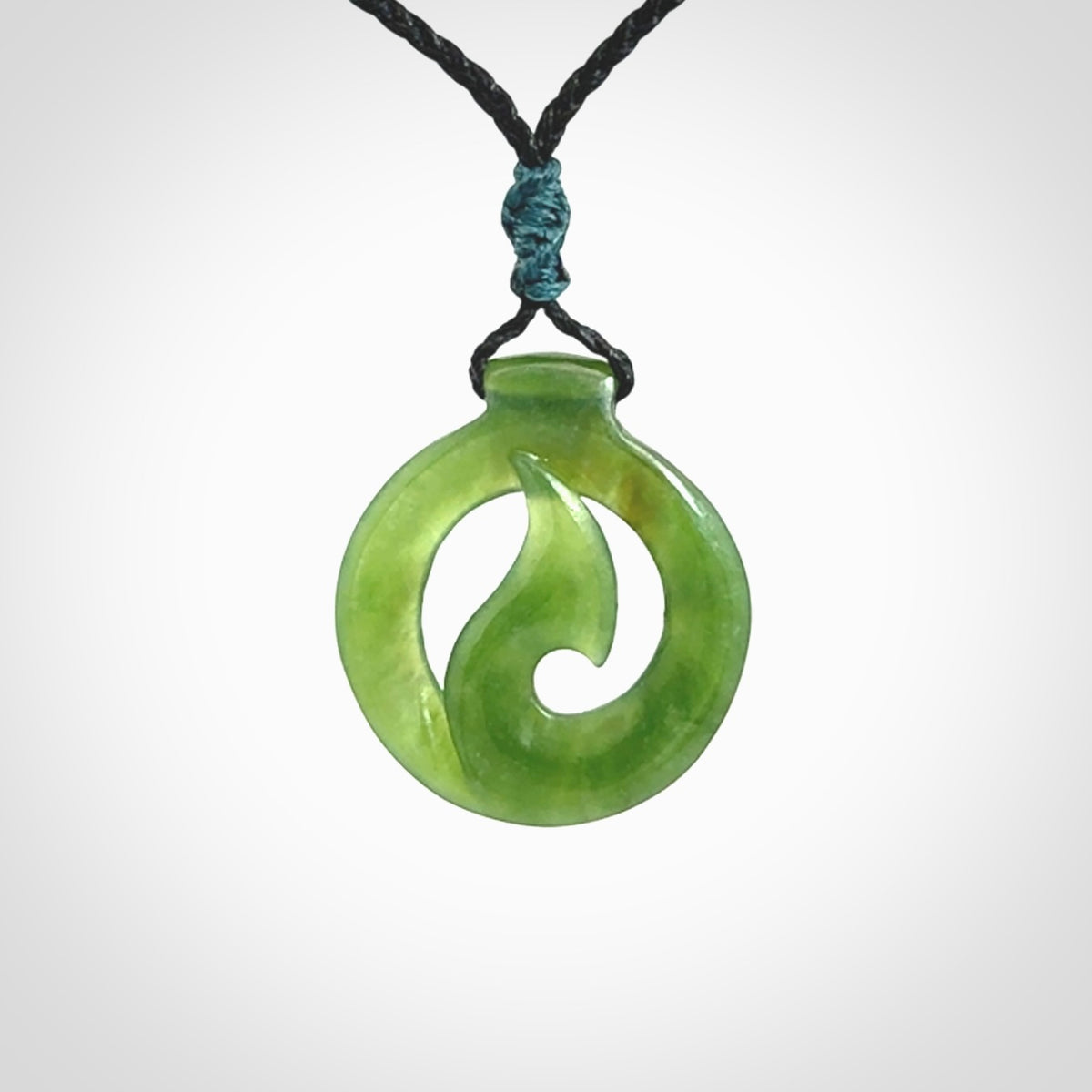 Jade matau or hook pendant. Carved from New Zealand pounamu in New Zealand. Hand carved jade jewellery for sale online.