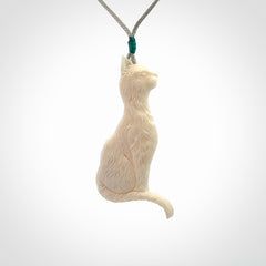 Hand carved bone cat pendant