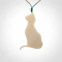 Hand carved bone cat pendant