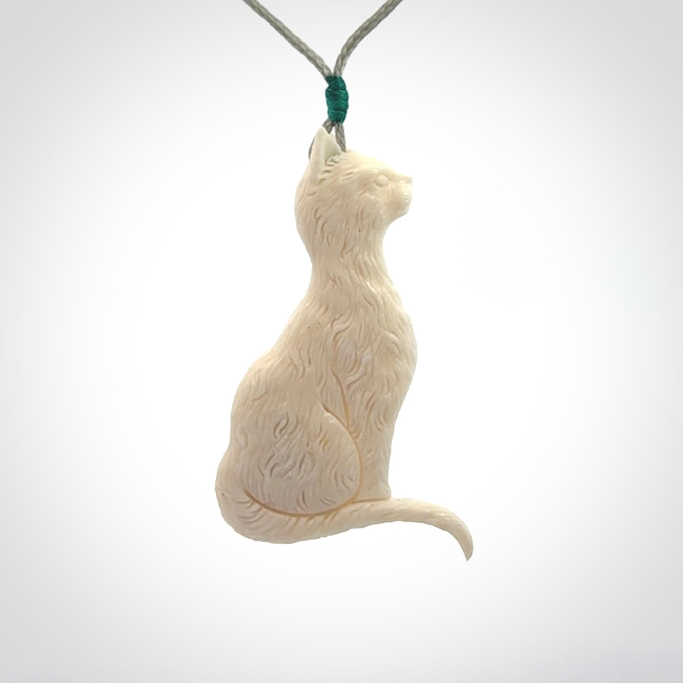 Hand carved bone cat pendant