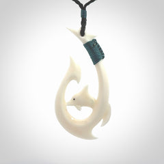 Hand carved bone hook with dolphin. This is a marine-themed pendant which we have made for dolphin lovers and for those of us that love the sea. This piece is handcarved from natural bone &nbsp;and is shipped worldwide free.