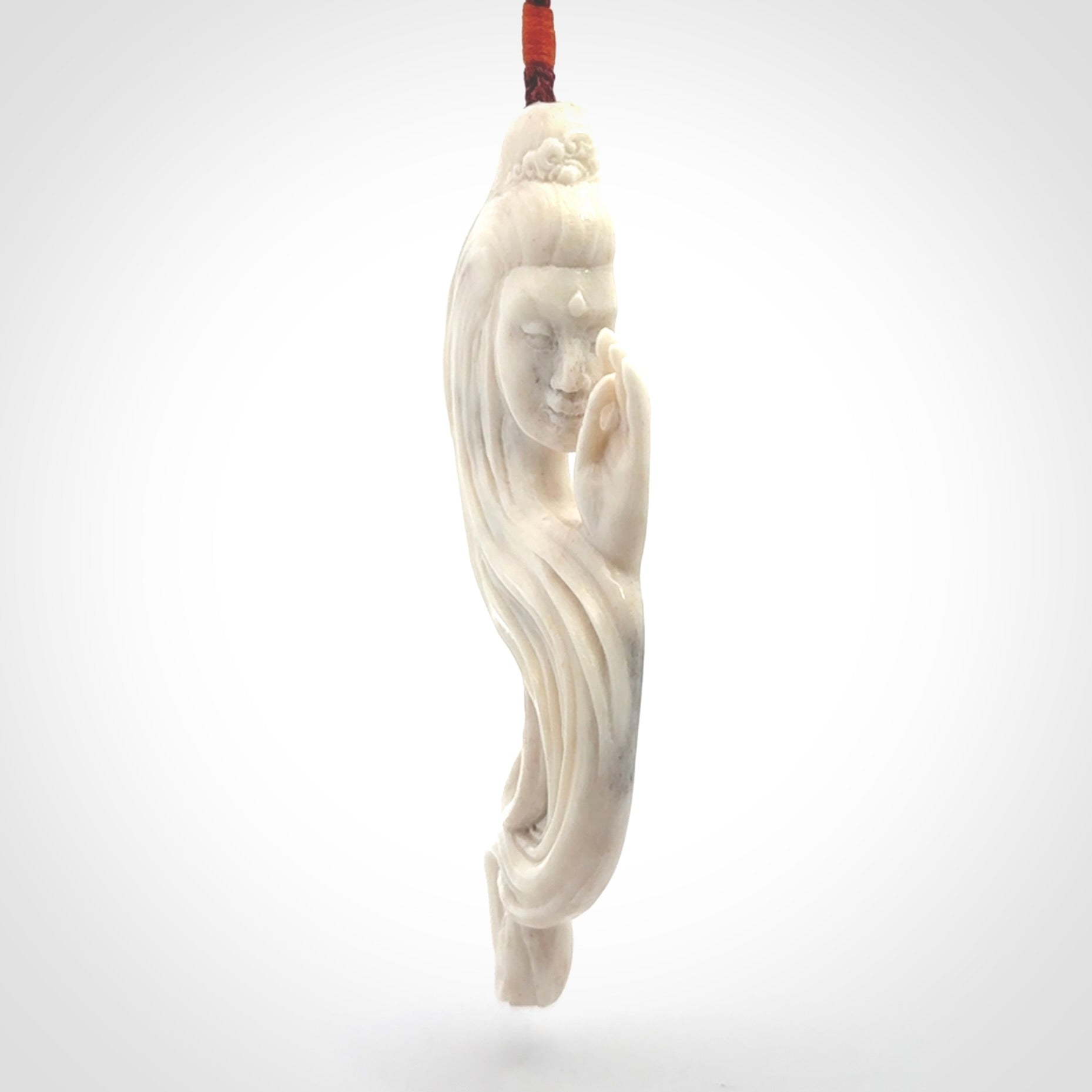 This is a contemporary large female pendant carved in bone. Hand carved and provided with an adjustable cord. Woman with shuni mudra hand gesture pendant.