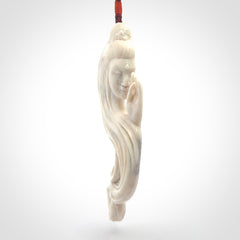 This is a contemporary large female pendant carved in bone. Hand carved and provided with an adjustable cord. Woman with shuni mudra hand gesture pendant.