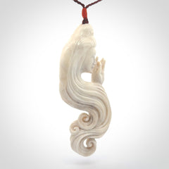 This is a contemporary large female pendant carved in bone. Hand carved and provided with an adjustable cord. Woman with shuni mudra hand gesture pendant.