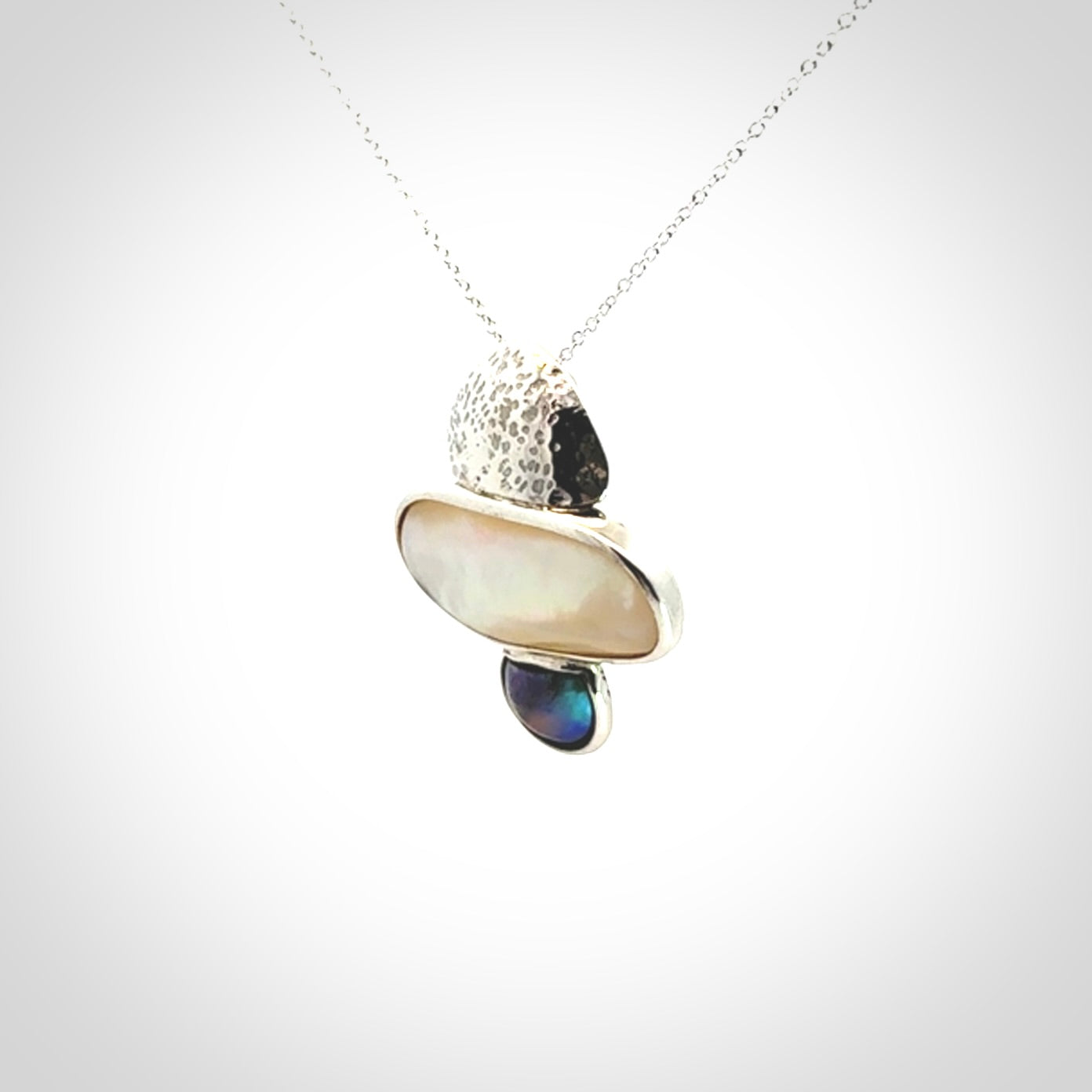 Hand crafted Sterling Silver with Mother of Pearl and Blue Eyris Pearl pendant