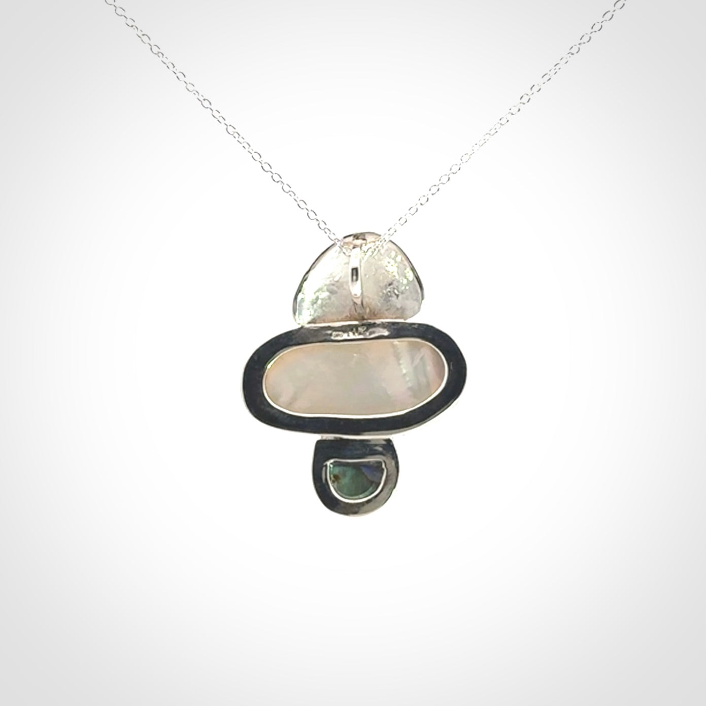 Hand crafted Sterling Silver with Mother of Pearl and Blue Eyris Pearl pendant