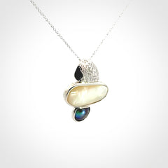 Hand crafted Sterling Silver with Mother of Pearl and Blue Eyris Pearl pendant