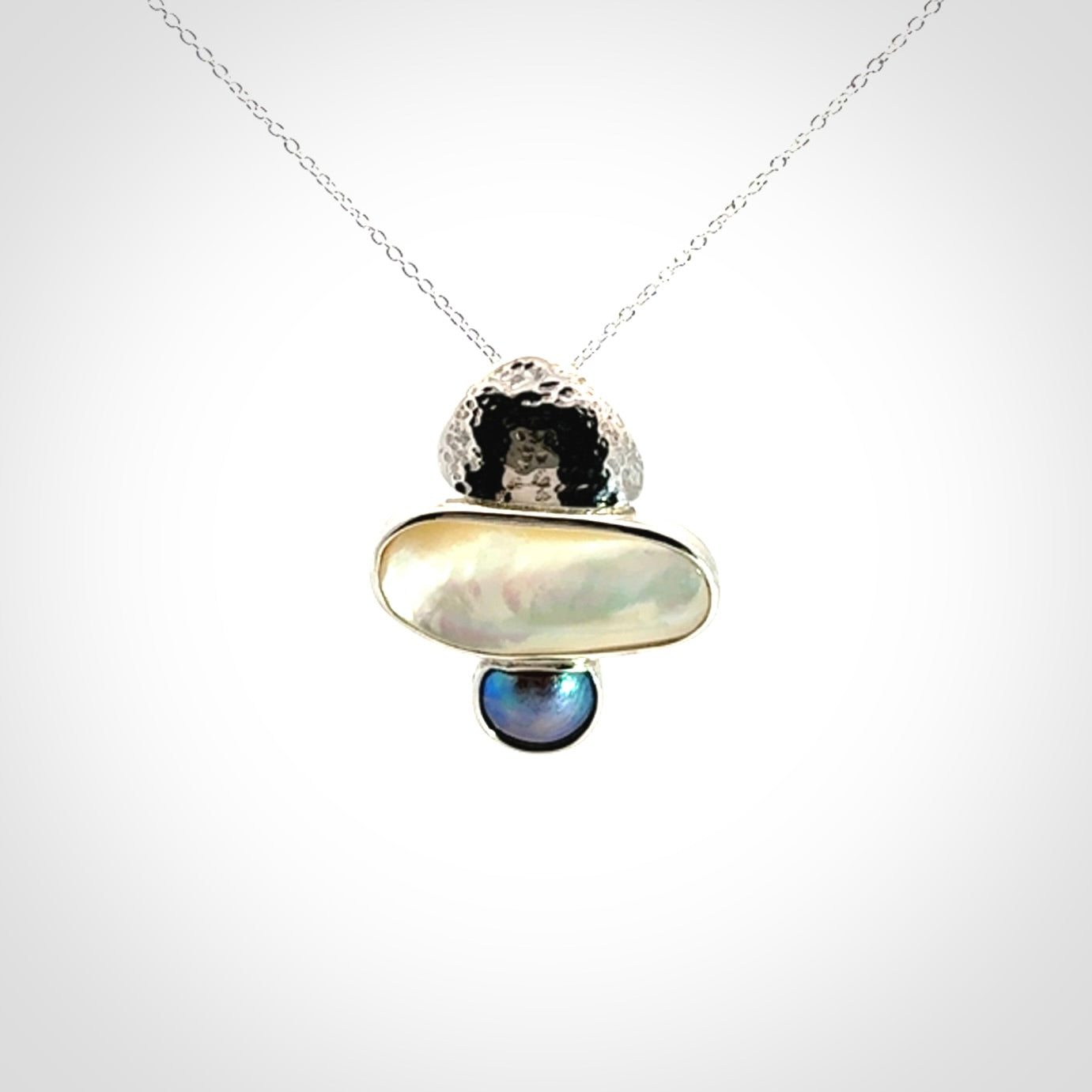 Hand crafted Sterling Silver with Mother of Pearl and Blue Eyris Pearl pendant