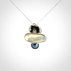 Hand crafted Sterling Silver with Mother of Pearl and Blue Eyris Pearl pendant