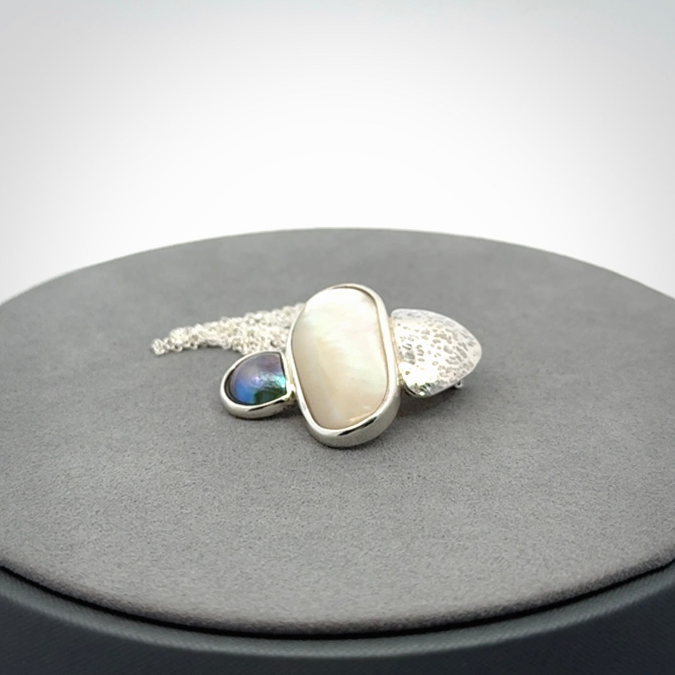 Hand crafted Sterling Silver with Mother of Pearl and Blue Eyris Pearl pendant