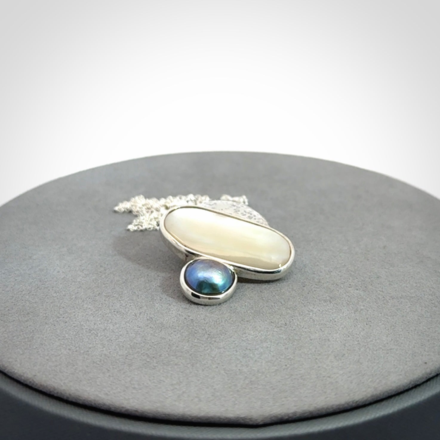 Hand crafted Sterling Silver with Mother of Pearl and Blue Eyris Pearl pendant