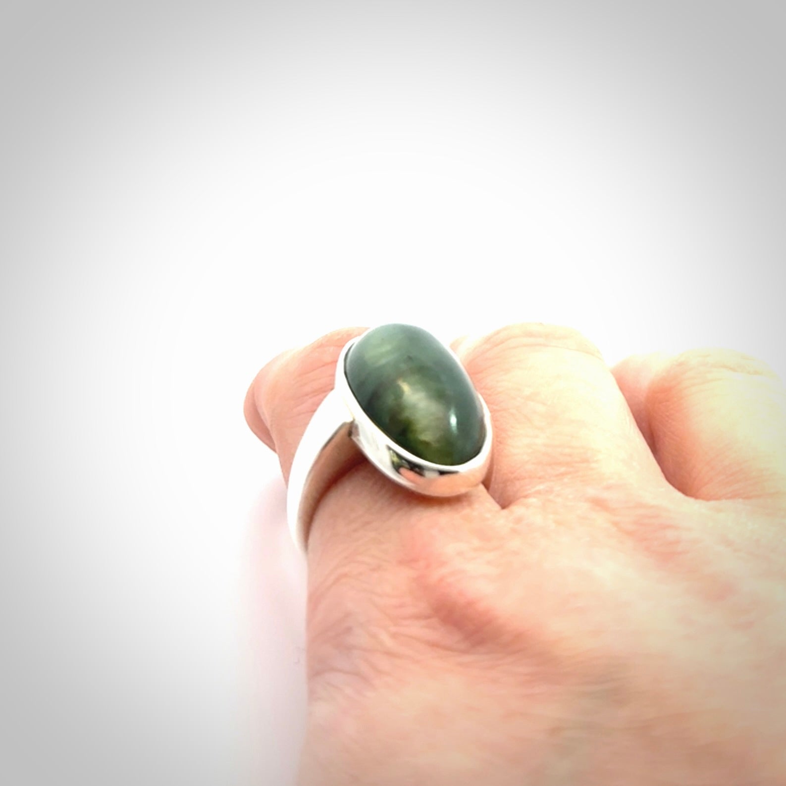 Sterling silver ring with chatoyant New Zealand Jade insert