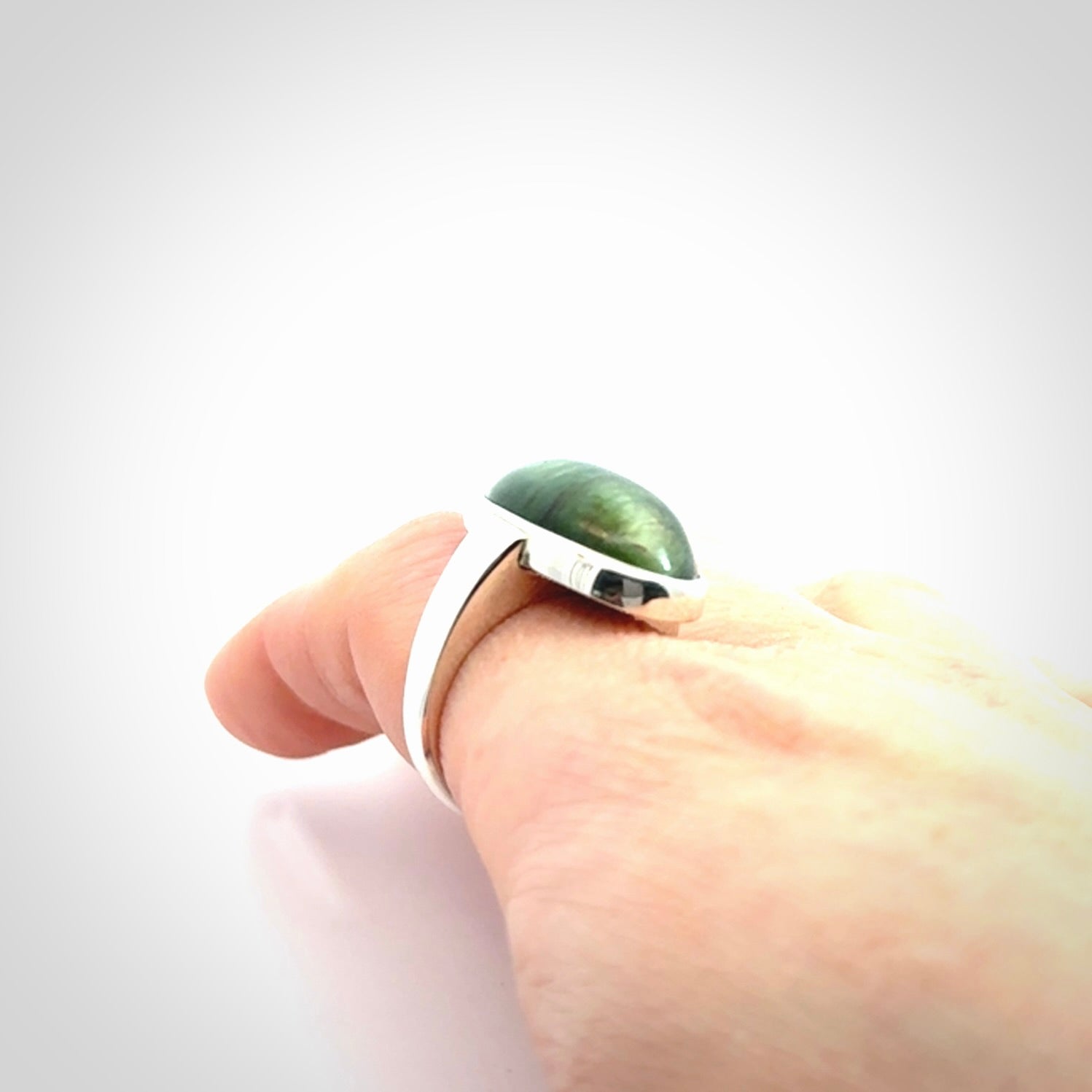 Sterling silver ring with chatoyant New Zealand Jade insert