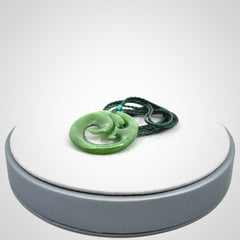 This pendant is a complex koru design. Carved in gorgeous New Zealand jade it is a medium sized pendant that can be worn by anyone. Hand made in New Zealand by NZ Pacific.