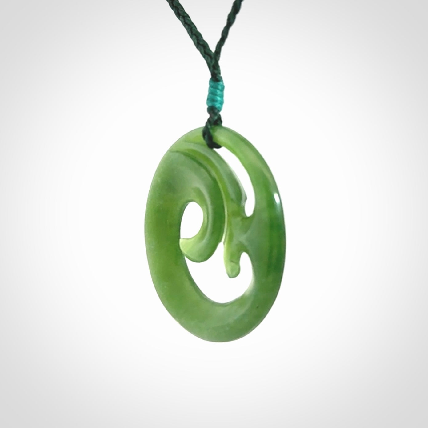 This pendant is a complex koru design. Carved in gorgeous New Zealand jade it is a medium sized pendant that can be worn by anyone. Hand made in New Zealand by NZ Pacific.