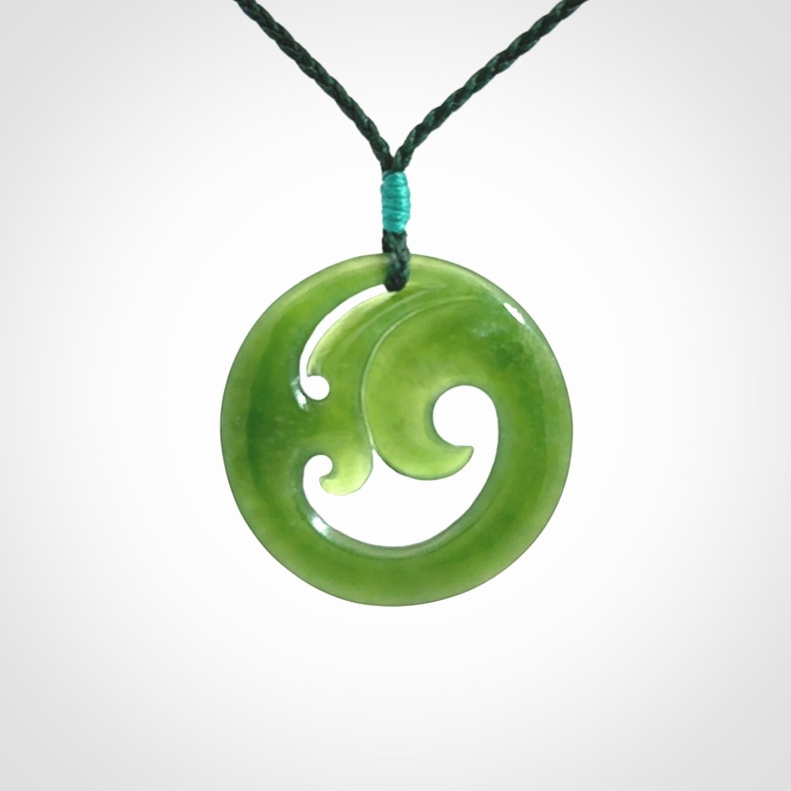 This pendant is a complex koru design. Carved in gorgeous New Zealand jade it is a medium sized pendant that can be worn by anyone. Hand made in New Zealand by NZ Pacific.