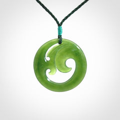 This pendant is a complex koru design. Carved in gorgeous New Zealand jade it is a medium sized pendant that can be worn by anyone. Hand made in New Zealand by NZ Pacific.