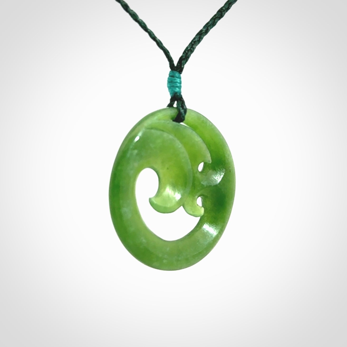 This pendant is a complex koru design. Carved in gorgeous New Zealand jade it is a medium sized pendant that can be worn by anyone. Hand made in New Zealand by NZ Pacific.