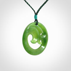 This pendant is a complex koru design. Carved in gorgeous New Zealand jade it is a medium sized pendant that can be worn by anyone. Hand made in New Zealand by NZ Pacific.