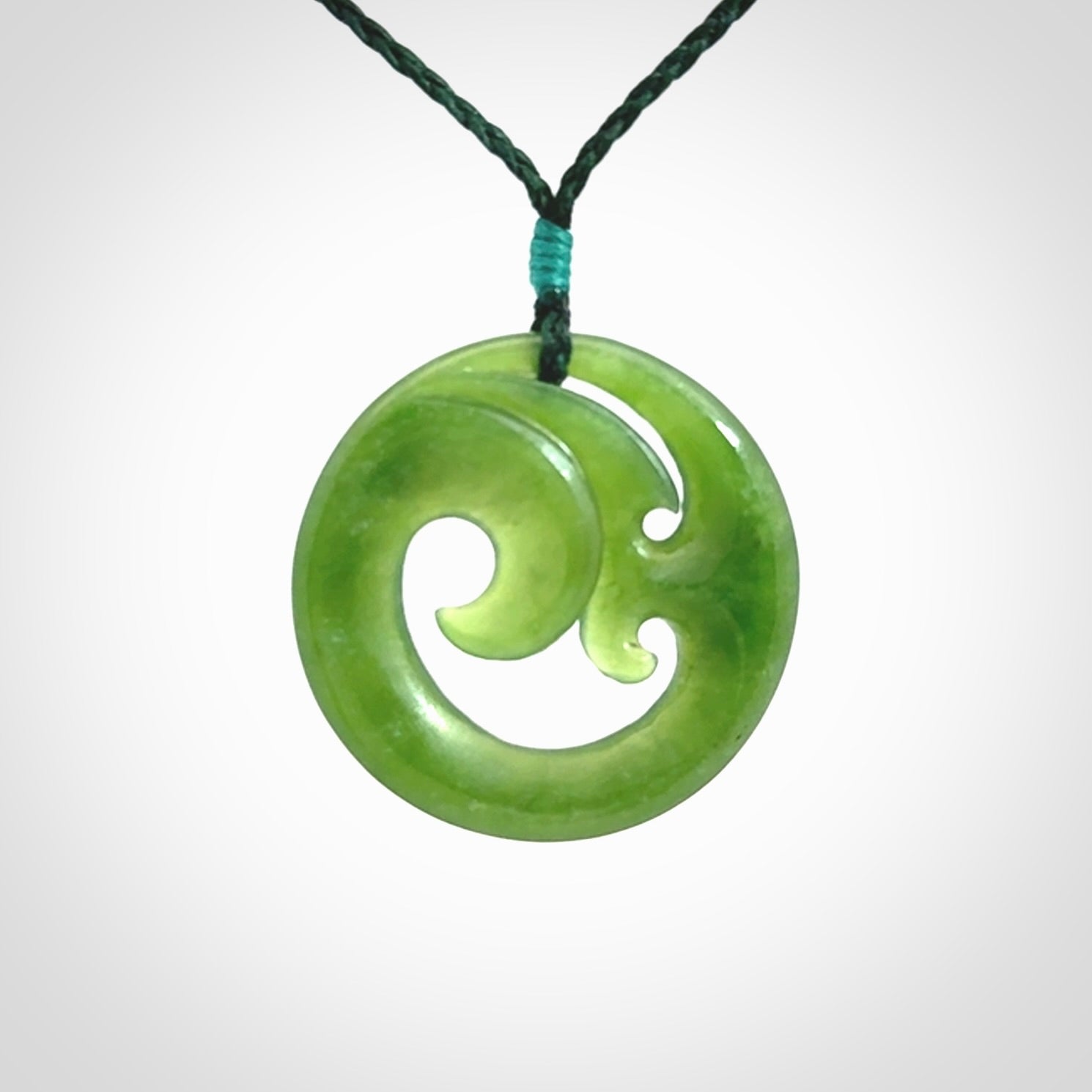 This pendant is a complex koru design. Carved in gorgeous New Zealand jade it is a medium sized pendant that can be worn by anyone. Hand made in New Zealand by NZ Pacific.