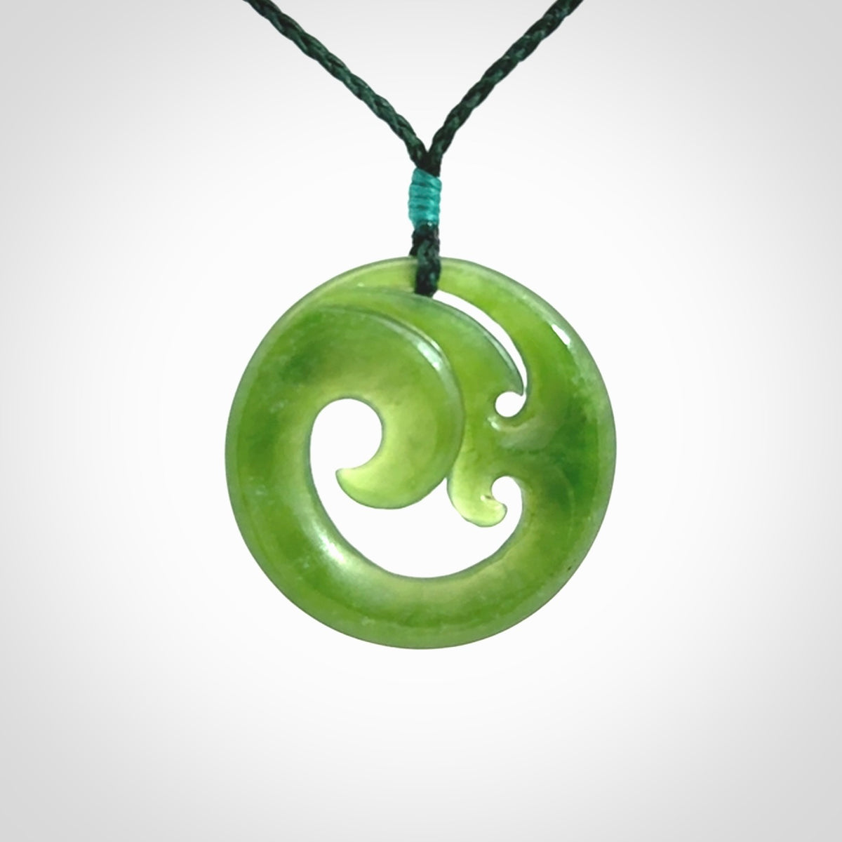 This pendant is a complex koru design. Carved in gorgeous New Zealand jade it is a medium sized pendant that can be worn by anyone. Hand made in New Zealand by NZ Pacific.