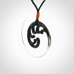 Hand carved pendant made from black jade with sterling silver. NZ Pacific contemporary Koru pendant for sale online.