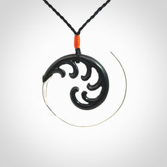 Hand carved pendant made from black jade with sterling silver. NZ Pacific contemporary Koru pendant for sale online.