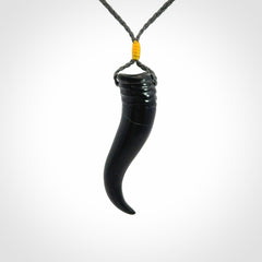 Black jade Italian Horn pendant. Handmade jade jewellery made by NZ Pacific and for sale online. Black Jade Goat Horn pendant worn for protection over evil eye, bad luck and promotes fertility. Ancient symbolic necklace hand made in Australian Black Jade.