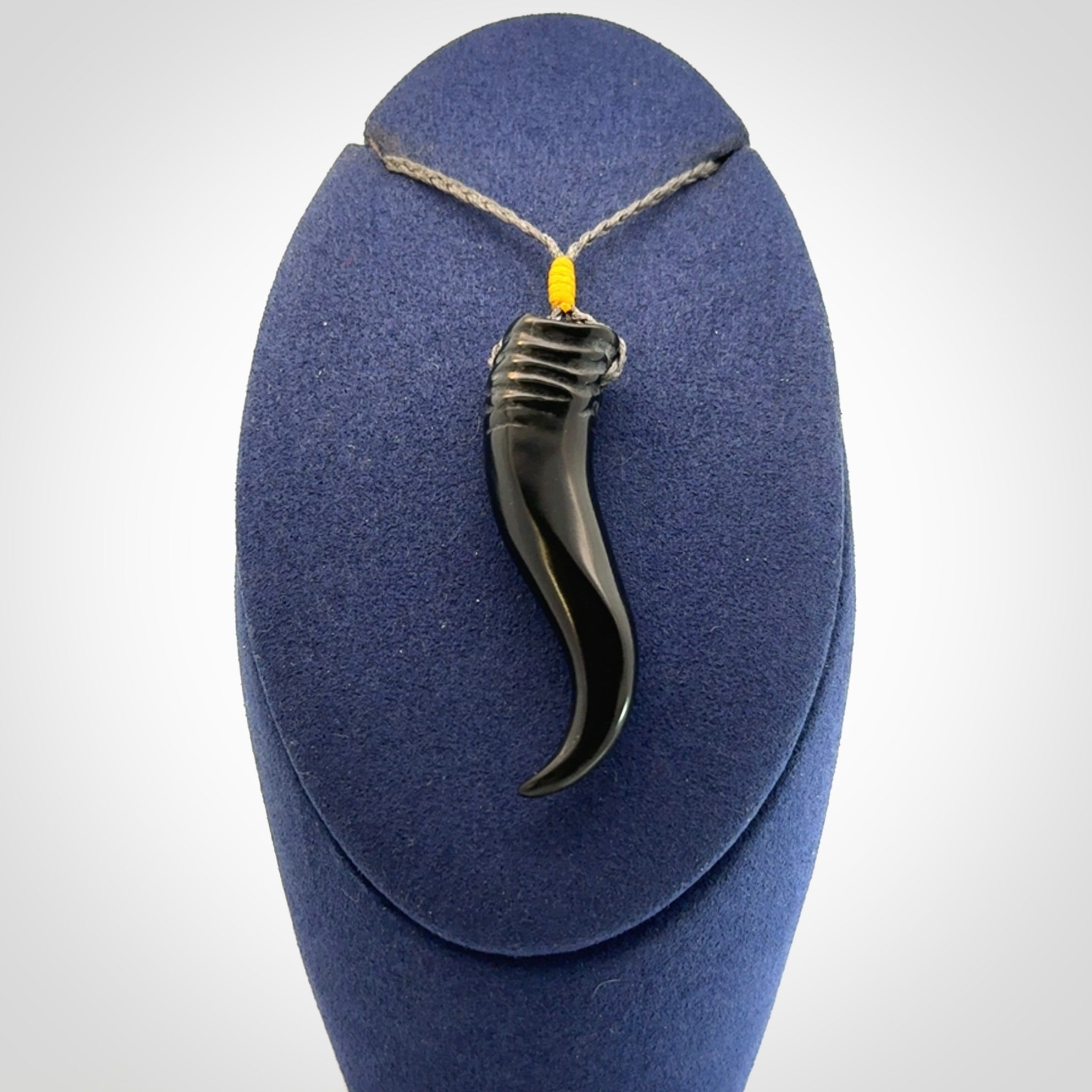 Black jade Italian Horn pendant. Handmade jade jewellery made by NZ Pacific and for sale online. Black Jade Goat Horn pendant worn for protection over evil eye, bad luck and promotes fertility. Ancient symbolic necklace hand made in Australian Black Jade.