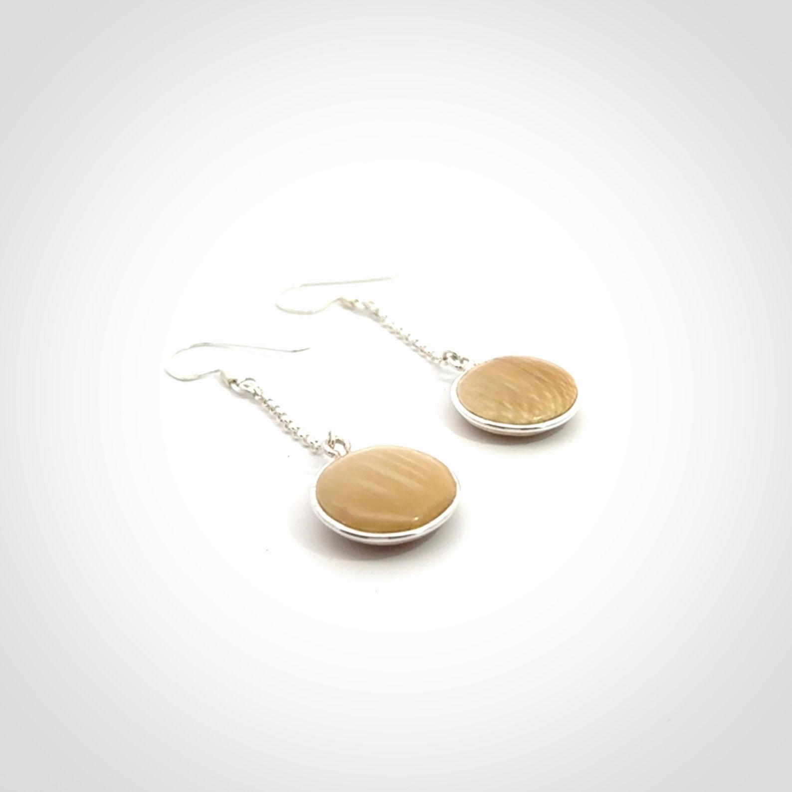 Hand made woolly mammoth tusk earrings. Made by NZ Pacific and sale online only.