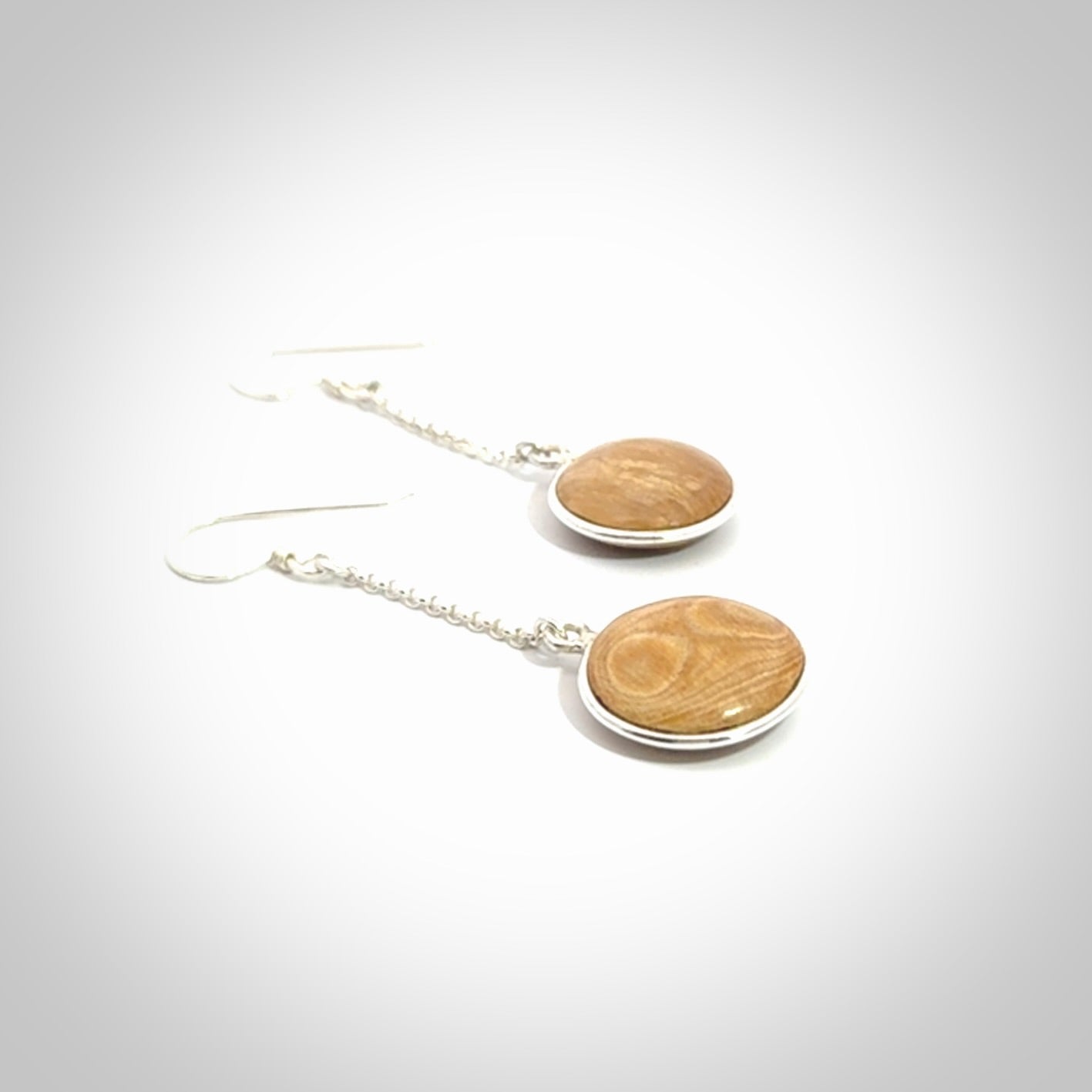 Hand made woolly mammoth tusk earrings. Made by NZ Pacific and sale online only.