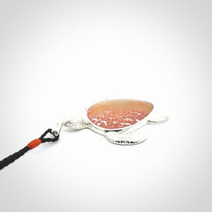 Snakeskin Agate stone turtle in Sterling silver engraved casing. Hand carved jewellery made by NZ Pacific and for sale online.