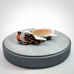 Snakeskin Agate stone turtle in Sterling silver engraved casing. Hand carved jewellery made by NZ Pacific and for sale online.